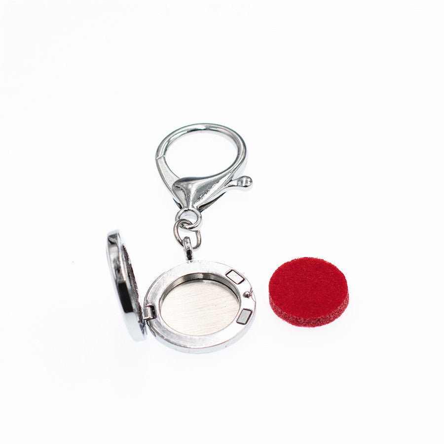 Wholesale 25MM Alloy Hollow New Flower Wings Aromatherapy Essential Oil Keychain